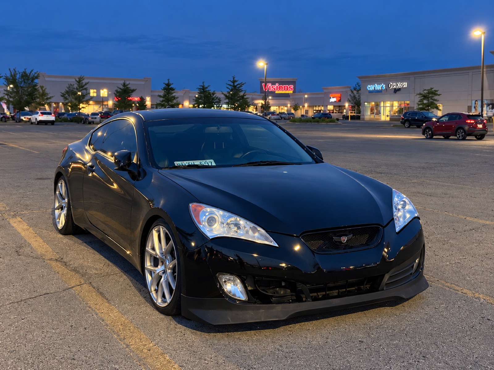 Sarah’s black coupe at blue hour